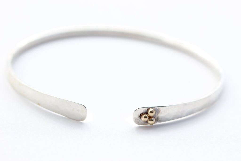 Hammered sterling silver bracelet with 14k yellow gold 