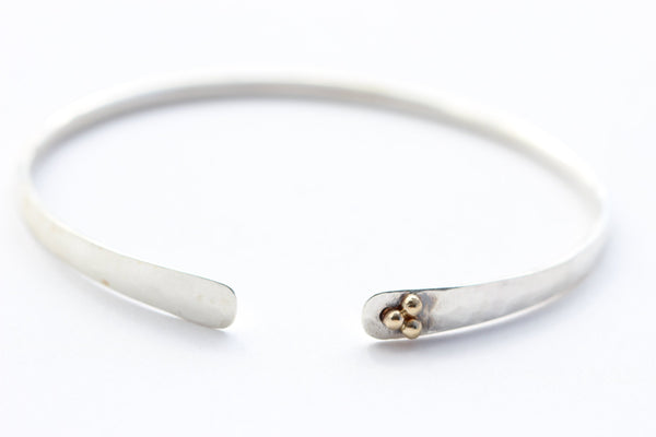 Hammered sterling silver bracelet with 14k yellow gold 